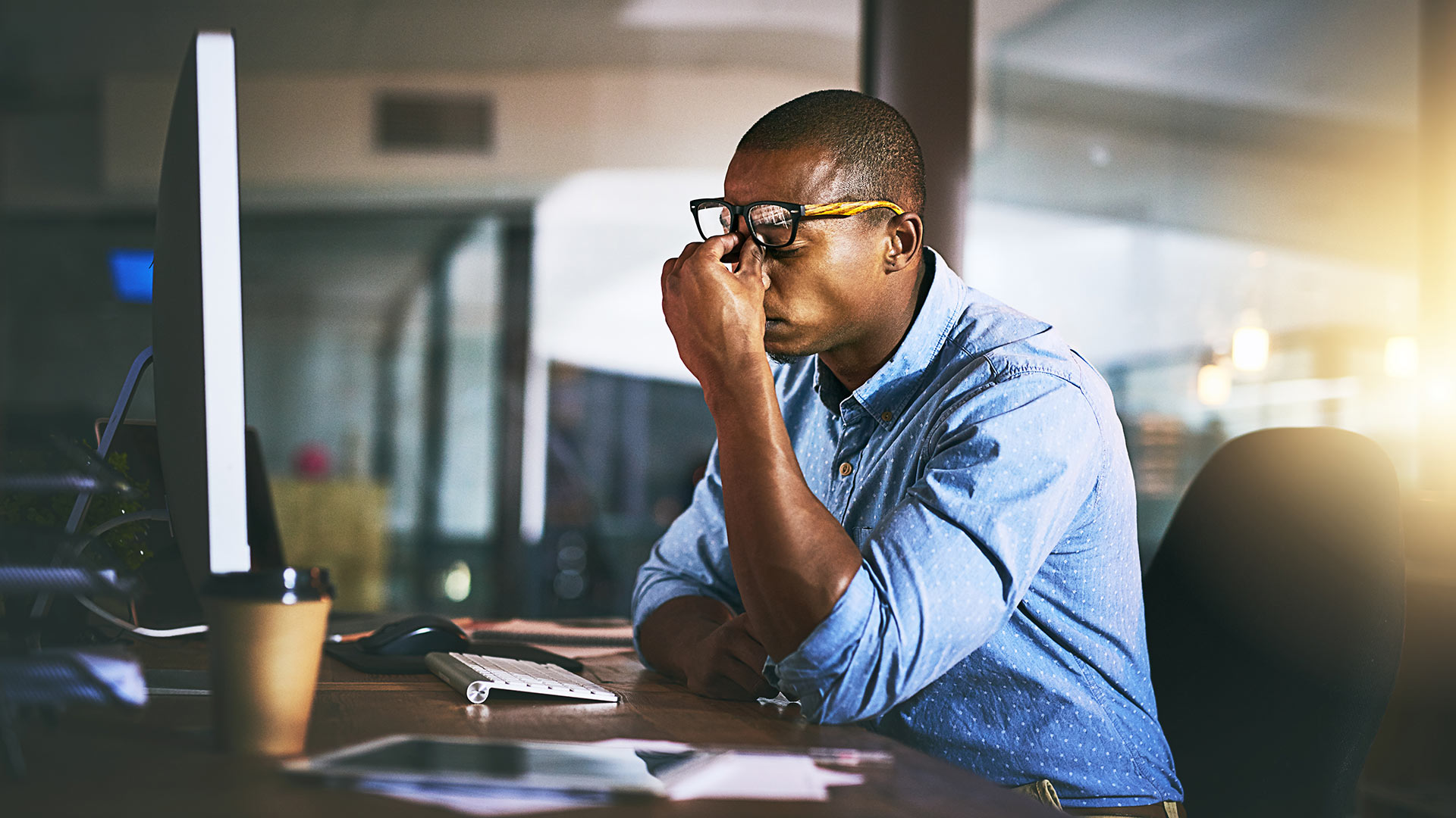 Man at computer looking frustrated