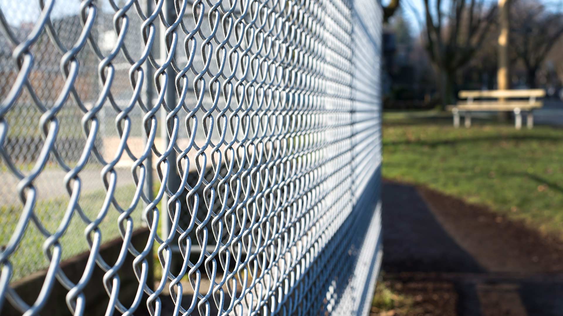 Closeup of a chain link fence at a soccer field